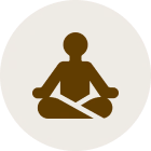 Brown silhouette meditating in dark circle