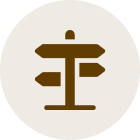 Directional sign silhouette in circle